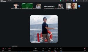 Tangkapan layar aplikasi Zoom di Windows yang menampilkan kegiatan Musyawarah Kerja IGTI, dengan deretan video/ikon peserta di bagian atas, satu foto peserta berukuran besar di tengah sebagai tampilan utama, serta bilah kontrol Zoom di bagian bawah berisi tombol Audio, Video, Participants, Chat, React, Share, More, dan Leave.